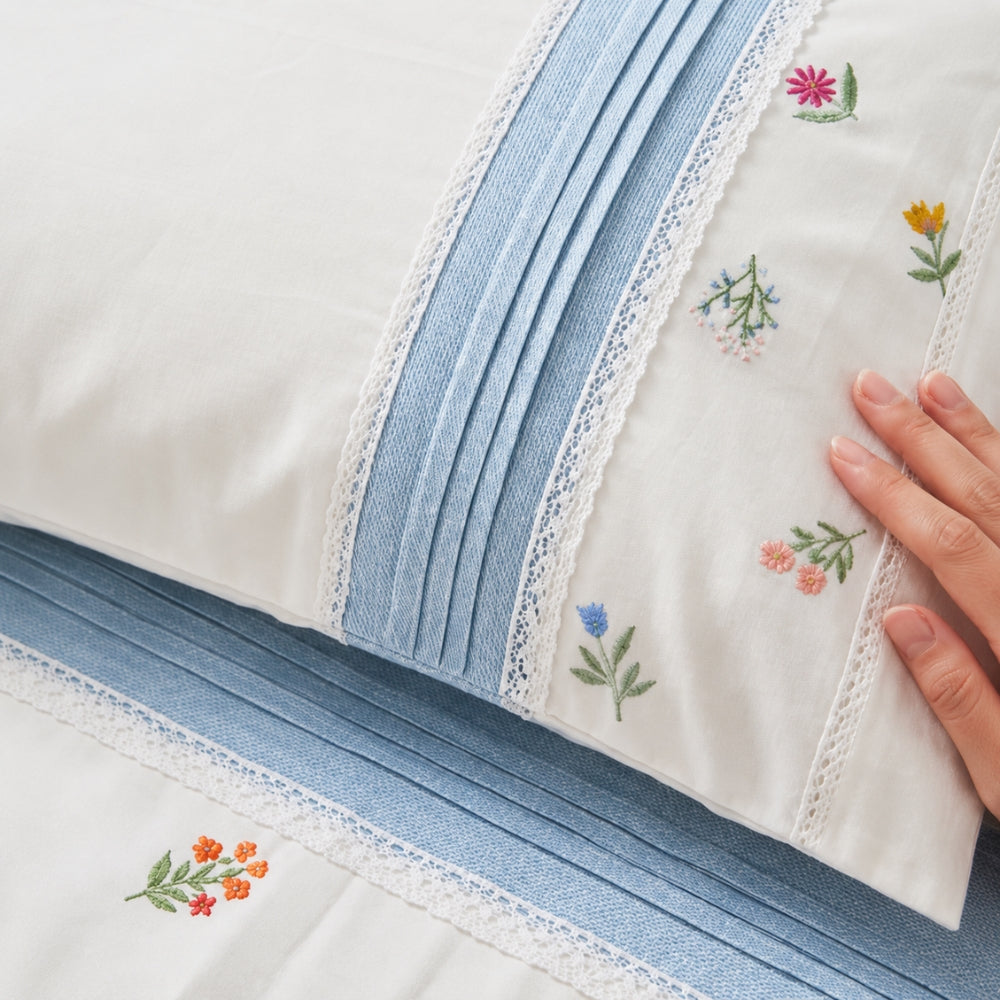Elegant White Bedsheet Set with Blue Striped Borders & Delicate Floral Embroidery